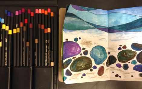 Work in progress of river stones using watercolor and Design Spectracolor colored pencils.